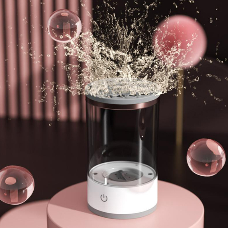 Electric makeup brush cleaner creating rotating water agitation